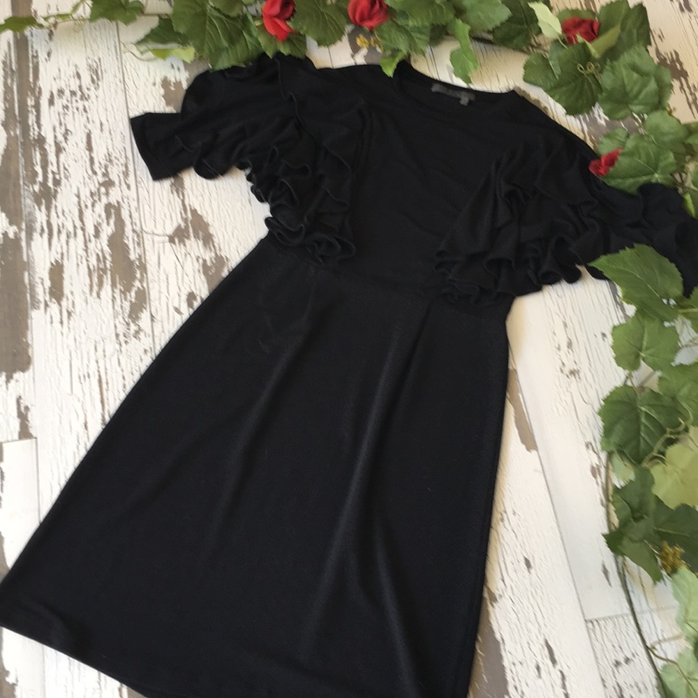 T O V Holy G Inc. dress in black with ruffles